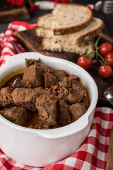 Beef meat stew in ceramic pot.