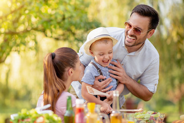 Family on vacation having lunch outdoors