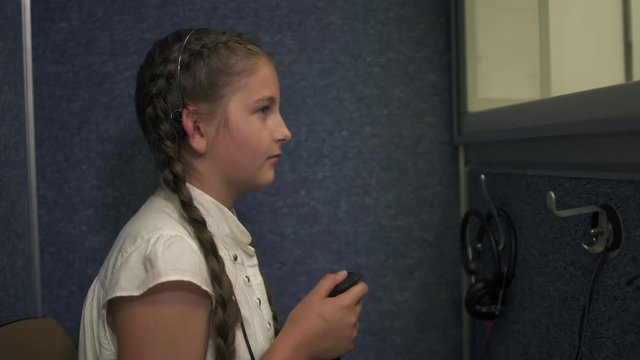 Little girl undergoes a hearing test