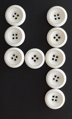 numeros hechos con botones blancos