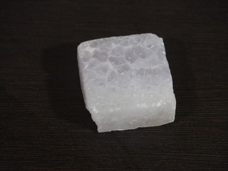 A lump of alum crystal. Alum is a very good chemical compound that is used as a medicine and for beauty treatment.