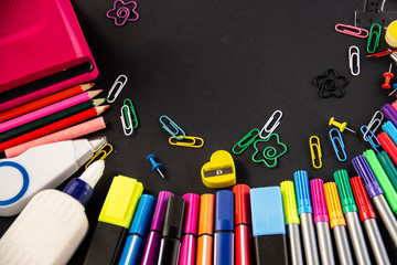 Office supplies for school on a black background