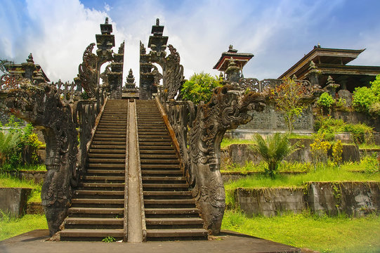 View to huge gate with stone dragons in Mother Temple Pura Besakih, Balinese largest Hindu temple and most famous place of worship.