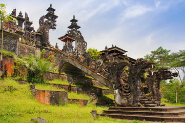 View to huge gate with stone dragons of Mother Temple, Pura Besakih, Balinese largest Hindu temple and most famous place of worship.