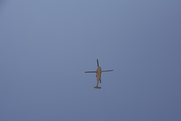 Transport Helicopter flying against the blue sky