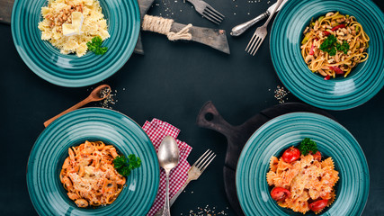 Pasta Set of Italian pastes. On a wooden background. Top view. Copy space.