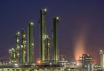 Fototapeta na wymiar Refinery Towers With Purple Sky