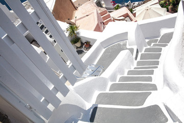Fototapeta premium Architecture of the island of Santorini, Thira, Greece. Descent on the white staircase