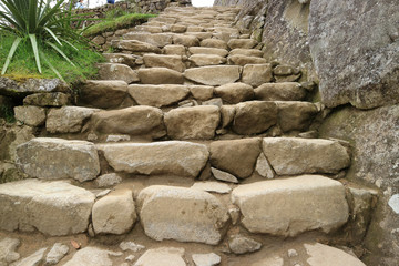 Ancient stone staircase in the famous archaeological site of Machu Picchu, Cusco Region, Peru