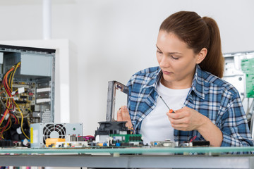 Woman repairing computer