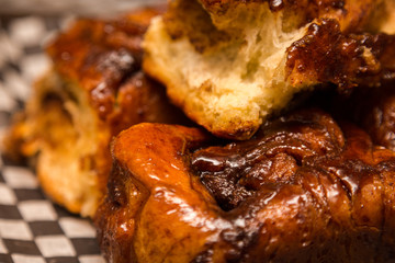 A close up of freshly baked cinnamon buns.