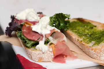 An Italian style sandwich with prosciutto and buffalo mozzarella.