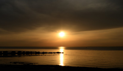 Fototapeta premium Cloud sunset over sea.
