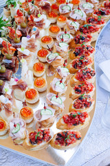 Beautifully decorated catering banquet with different food snacks and appetizers