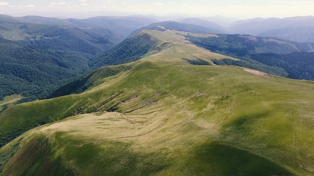 Aerial shot of a Carpathian range resembling a lying monster in summer
