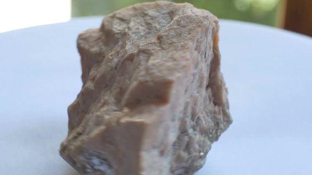 View of geological Orthoclase mineral sample. Orthoclase, or orthoclase feldspar  is an important tectosilicate mineral which forms igneous rock.