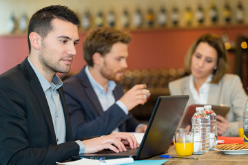 business people having breakfast together concept
