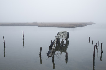 An abandoned dock in river Evros,Greece on a foggy winter morning.