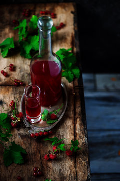 red currant homemade liquor.style vintage. selective focus