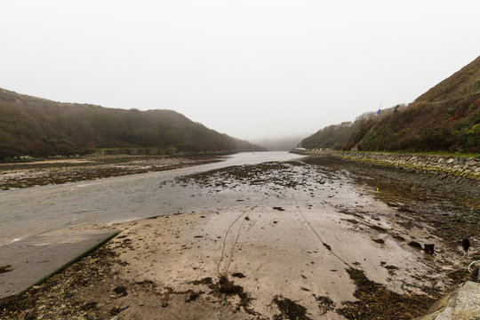 Bay in evening mist. Mouth of the River Solva