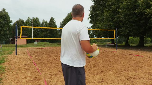 Athlete with colored volleyball ball