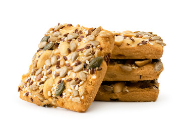 Cookies with nuts and seeds closeup on a white. Isolated.