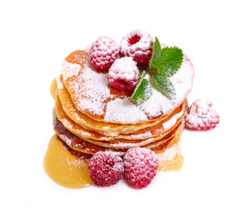 Pancakes with raspberries and honey or maple syrup. Isolated on white background