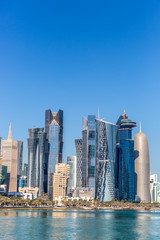 Fototapeta premium DOHA, QATAR - JAN 8th 2018: The West Bay City skyline as viewed from The Grand Mosque on Jan 8th, 2018 in Doha, Qatar. The West Bay is considered as one of the most prominent districts of Doha