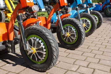 Fototapeta na wymiar three wheel electric bicycle row in rental point
