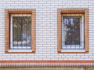 White plastic window with a lattice. Protection against hacking.