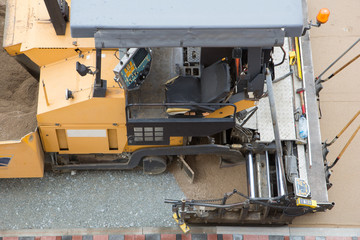 asphalt paving machine from above working on street