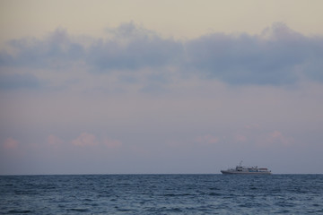 ship in the sea at sunset