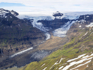 view from peak Kristinartindar with glacier tongues  Skaftafellsjokull, waterfalls, colorful rhyolit mountains,Vatnajokull spur in Skaftafell Park, South Iceland