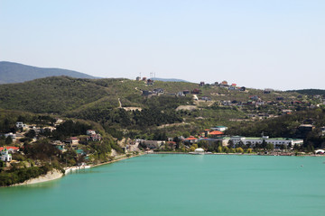 Fototapeta na wymiar A panorama of lake Abrau and the manufacture of champagne Abrau-Durso, Russia