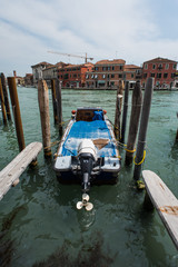 Fototapeta na wymiar Boat in the water canals of Venice