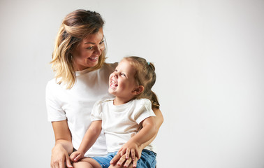 Happy Mother with cute daughter portrait child on white background with copy space