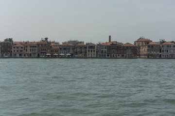 Venice city view from the sea. Local famous architecture.