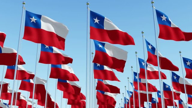 Many flags of Chile fluttering in the wind on flag poles in a row against blue sky. Three dimensional rendering animation.