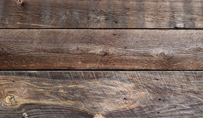 Unfinished barn board siding showing weathering, grain, knotholes and years of abuse © jGodsey