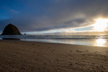 Sunset on Cannon Beach in Oregon with a view of Haystack Rock in the Pacific Northwest USA