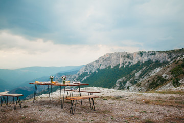 Fototapeta na wymiar Table prepared for dinner on a mountain top
