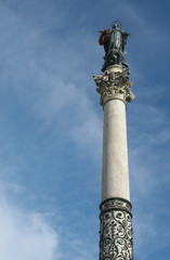 Rome,Italy-July 27, 2018: Column of the Immaculate Conception carrying a wreath of flowers