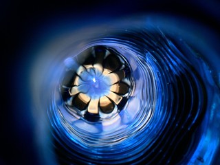 Beautiful unusual blue abstract background. The flower under the water