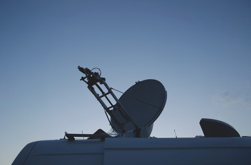 Satellite Dish on the roof of a car