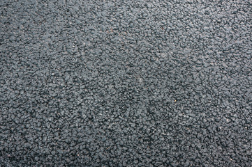 natural stone paving stone road from asphalt background summer