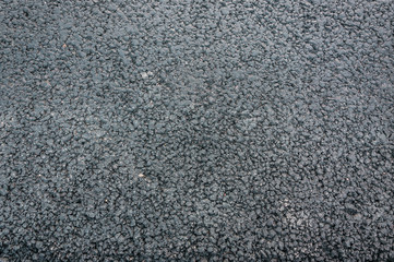 natural stone paving stone road from asphalt background summer