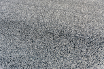 natural stone paving stone road from asphalt background summer