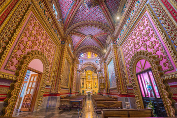 Fototapeta na wymiar Stunning and colorful interior decor of San Diego temple in Morelia, Michoacan, Mexico