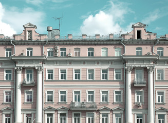 Facade of a historic pink building on tverskaia street in Tverskoi area in Moscow, Russia.