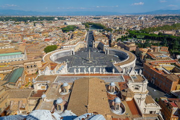 Aerial top view of St. Peter's Square and Vatican Obelisk from the roof top of Saint Peter Basilica. Panoramic view of Rome, Vatican city, Castel Sant'Angelo, riverside of Tiber river in Rome, Italy.